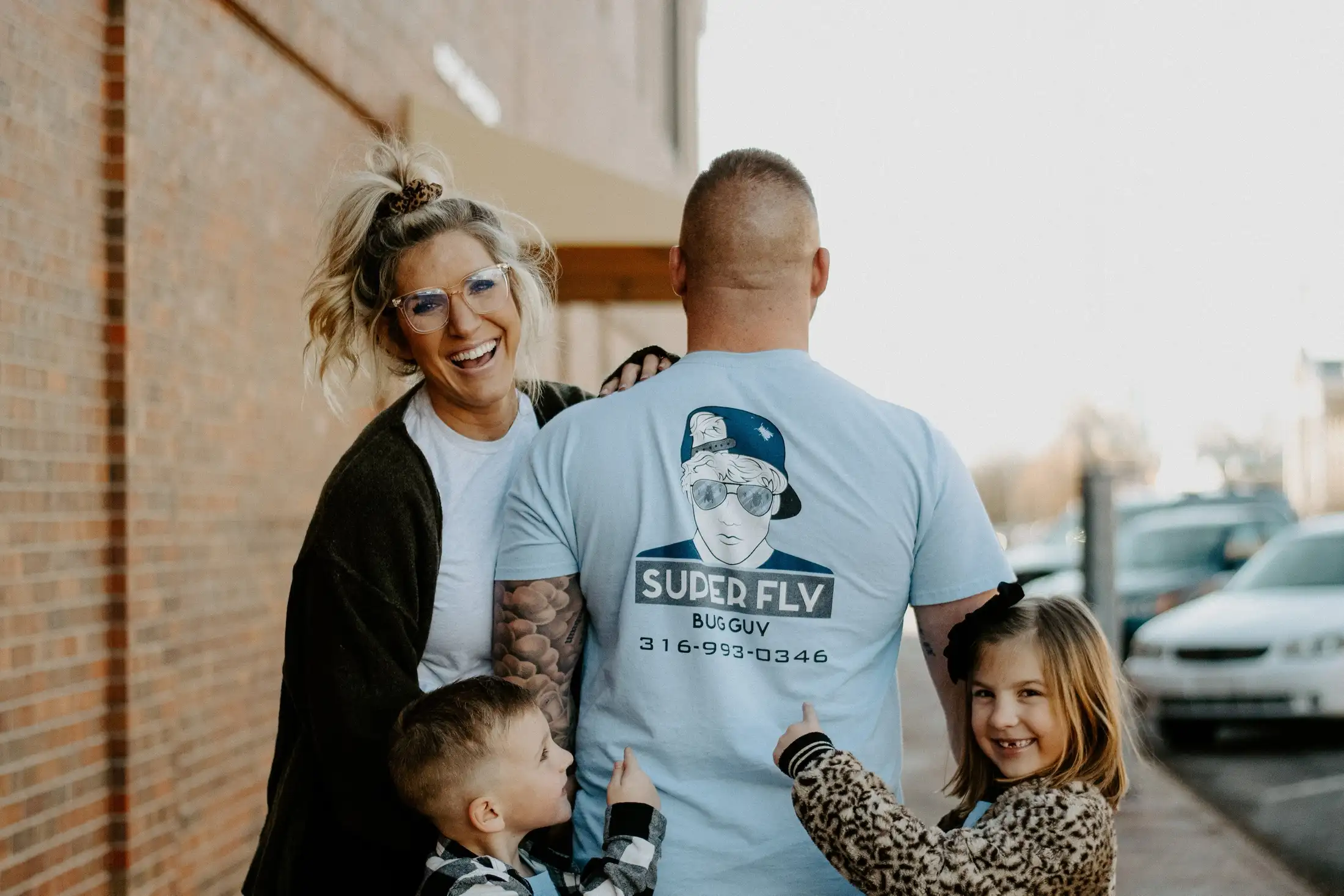 A family wearing a t - shirt with a picture of bernie sanders.